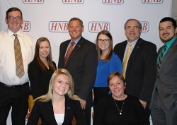 7 members of HNB take picture with President for their 5 years of service.
